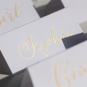 White table setting with gold ink