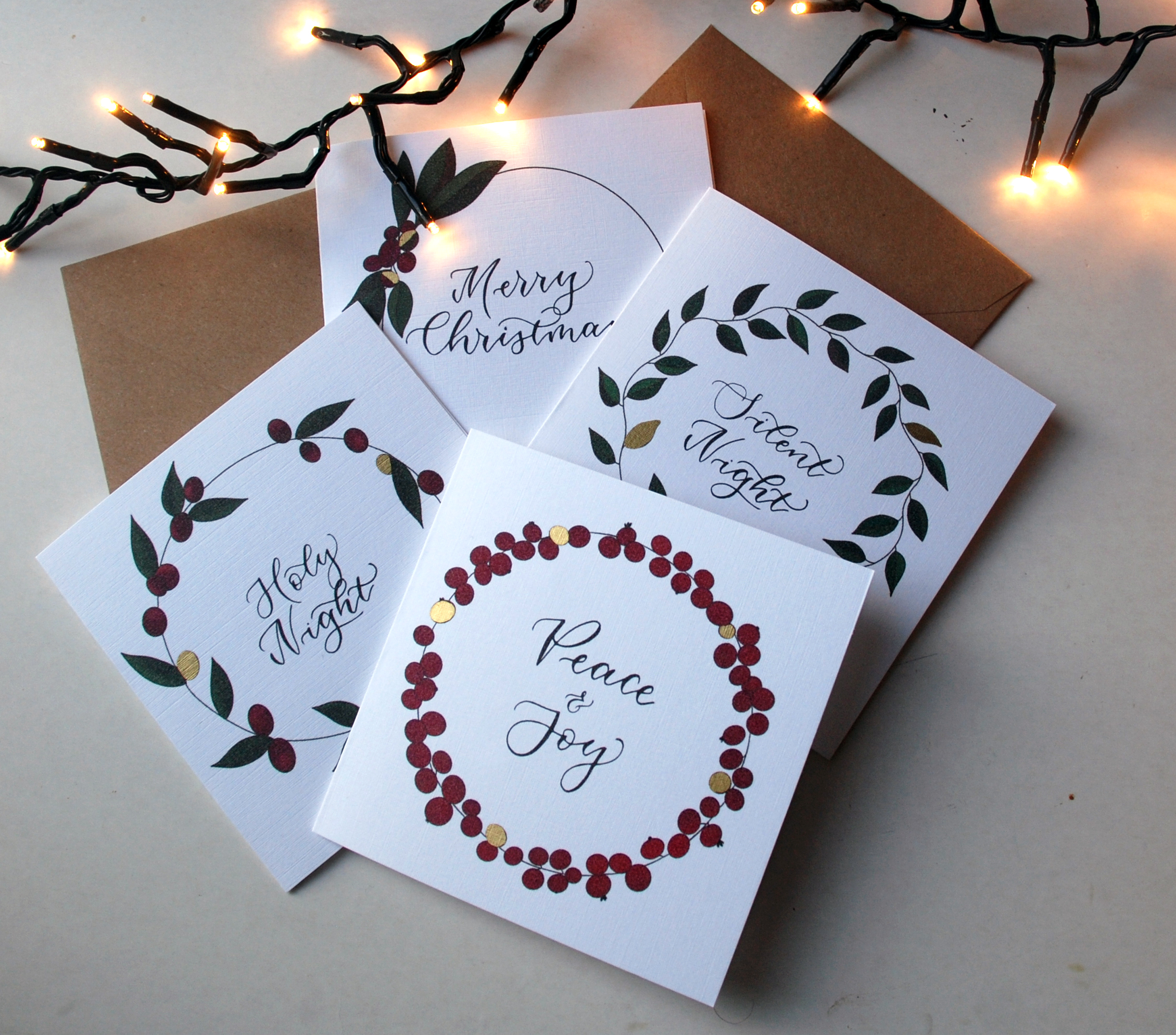 Festive wreath and foliage Christmas cards