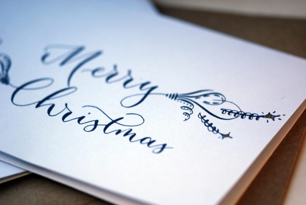 Close up of Christmas card written in calligraphy in A6 size