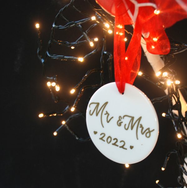 Personalised porcelain baubles with gold ink for christmas tree for married couple
